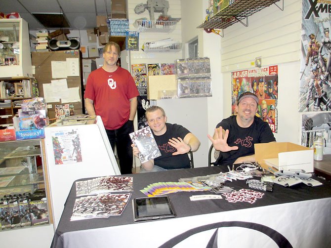 E.G. Comics owner Edwin Gumel hosts “Unit 5” creators Alex Robson and Skip Winter. Koons Scion of Tysons Corner sponsored the launch event at the comic book store, with prizes and refreshments, on Saturday, Feb. 16.
