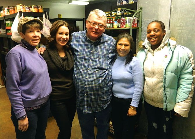 Sarah Heckman, second from left, takes a break with her pantry volunteers Karen Johnson, Bill Walters, Mena and Nichola Carter. 