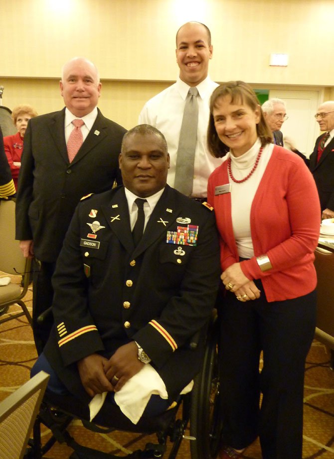 Keynote speaker Col. Gregory Gadson, center, visits with Mary Scott, board chairman of the Alexandria-based National Military Family Association, Gen. Bruce Scott (ret.) and West Point senior cadet Caleb Bloom prior to the Feb. 18 breakfast.