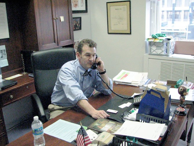 State Senator Chap Petersen (D-34) works the phones in his Richmond office after Monday’s General Assembly session.
