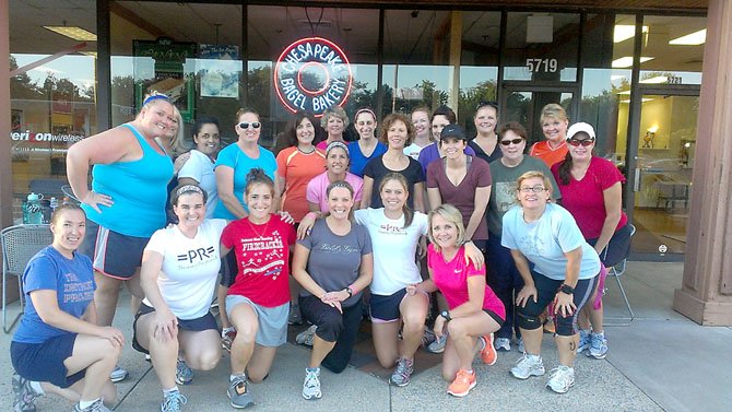 Members of Kelly Kavanaugh’s Running 101 class strike a group pose after a workout. Sixteen women are making the trip down to Disney World to do their best impressions of Tinkerbell in running shoes.
