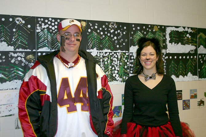 Fairview Elementary P.E. Teachers Fred Pechin and Kendra Roland dress up after students collect 5,671 Box Tops during contest. 