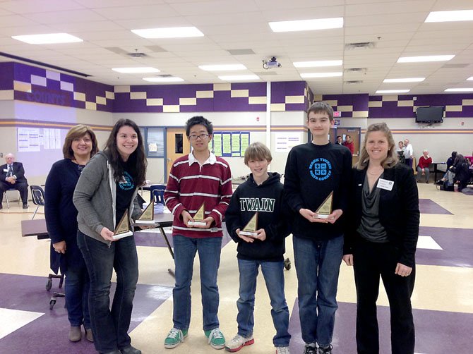 From left, Lynn Gilmore (corporate citizenship director, Northrop Grumman Information Systems), Rachel Moneypenny, Peter Zhao, Caulton Wilson, Zachary Hayden and Heather Naples (president, Brown Construction Services) pose after the trophy presentation at this year’s MATHCOUNTS regional competition.
