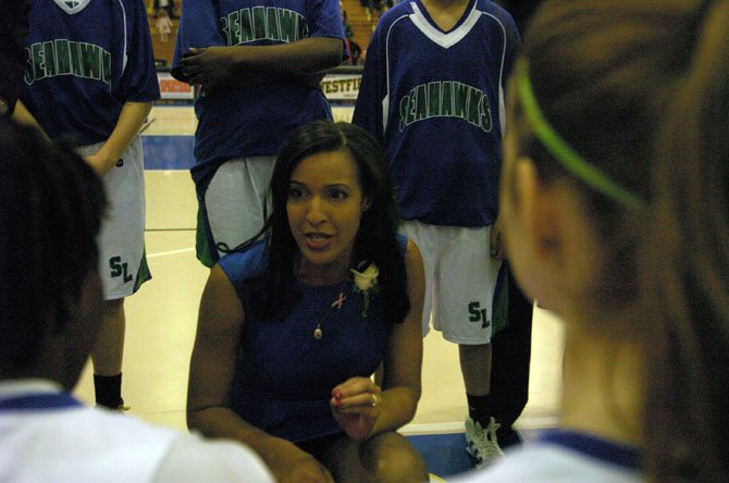 South Lakes girls’ basketball coach Christy Winters-Scott speaks to the Seahawks during the Northern Region championship game against Edison on Saturday, Feb. 23, at Robinson Secondary School.