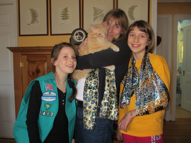 Preschool teacher Terry Ayotte with daughters Tallie and Amelia Uman and two-and-a-half-year-old family pet Sandy Neck, Vienna.