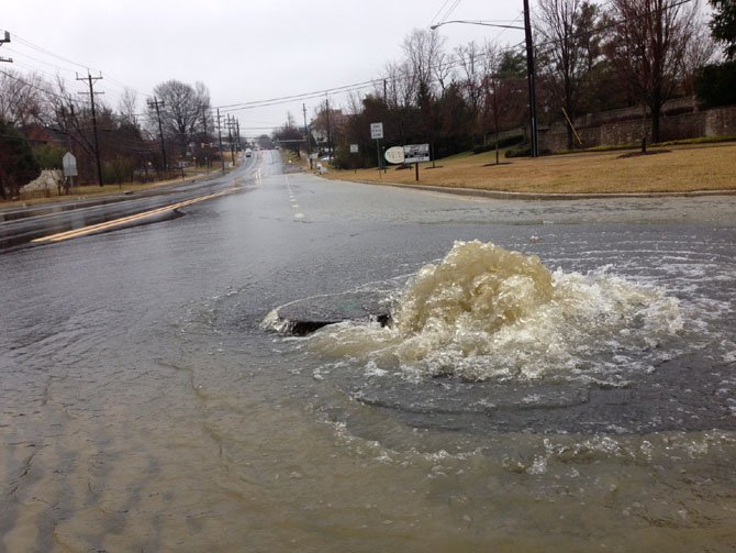 A water main break creates a flood of water on River Road Saturday, Feb. 23.