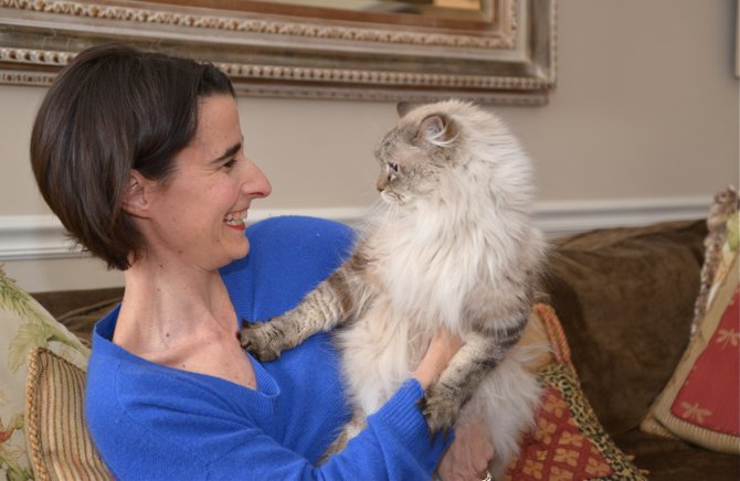 Jennifer Boysko shares a moment with maybe 12-year-old Sam, her daughter Sophie Claire's sixth birthday request back in 2004. Sam, like many family cats, likes to set the family rules ... in particular bed times.