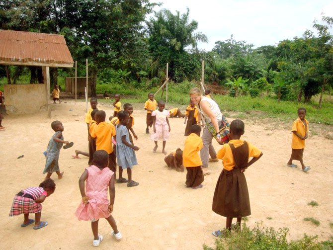 Gayle Robinson playing with some of the students at the
school.