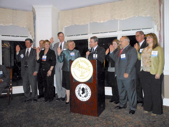 Outgoing Chamber Chairman Michael Gailliot installs new officers and board members for 2013.