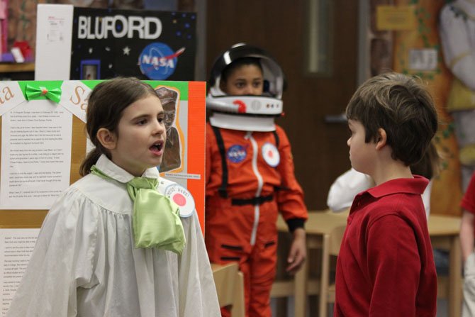Washington Episcopal  Grade 3 student  Giovanna Massaro (age 9) portrays sculptor Augusta Savage (foreground), and Cameron Hall (age 8), portrays astronaut Guion Bluford, while classmate Julian Haas (age 8) listens to Giovanna’s speech (far right) in their Black Facts Museum at the school this week.