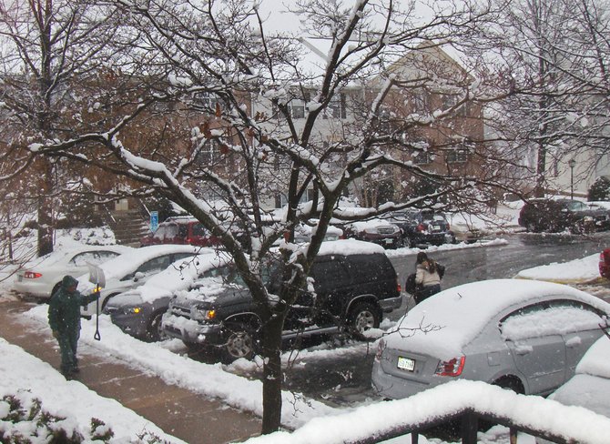 This man has just finished shoveling the sidewalk in this Fair Oaks neighborhood.
