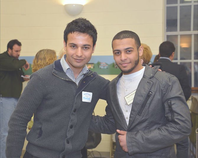 Ahmad Shah Hemmat, one of the guest speakers, talks with award recipient Khaled Hasanin, a senior at Islamic Saudi Academy Boy’s School. Ahmad attended the Seeds of Peace camp for children from regions of conflict and continues to promote the message of peaceful conflict resolution today. Khaled founded the Islamic Club at his school to help promote good behavior in the lower grade levels. 
