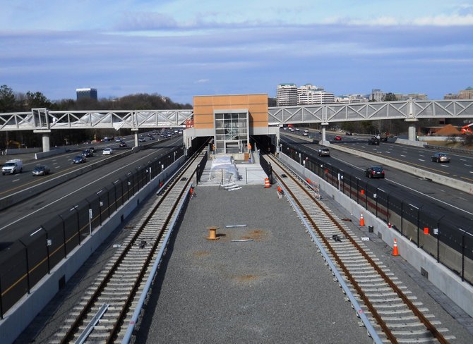 The photo shows significant progress as seen from the median of the Dulles International Airport Access Highway/Dulles Toll Road looking west towards the Wiehle-Reston East Station. 