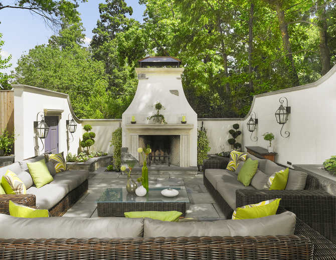 An outdoor fireplace is the focal point for an award-winning remodeling project by Anthony Wilder Design/Build, Inc.
