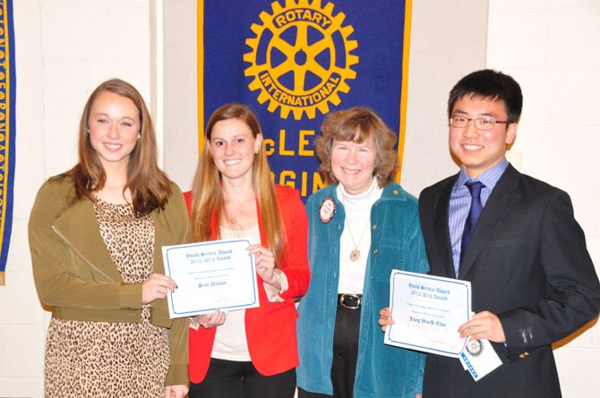 From left, Langley High School junior Rebecca Pifer, Potomac School senior Britt Nelson, McLean Rotary Club President Jan Auerbach and McLean High School senior Jung Wook Choi. The McLean Rotary awarded the three students $250 scholarships Tuesday, March 12, for their service to the community. 