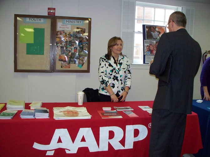 Amber Nightengale from AARP discusses memory coping resources with workshop attendee.