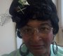 Mary Baker wears a small black hat with ...