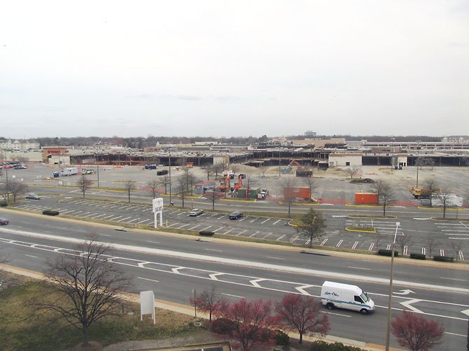 Demolition progresses on the old Springfield Mall as excavators, barbed wire, sand trucks and other demolition equipment turns the mall into a construction site. Photo taken Thursday, March 14.
