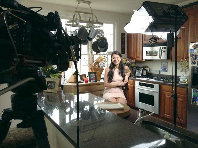 BethAnn Telford being filmed in her Fair Lakes kitchen for the Discovery Channel.
