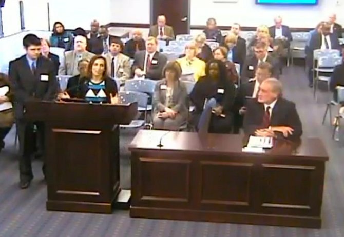 School Board Vice Chairman Justin Keating, left, listens as School Board Chairwoman Karen Graf, at lectern, speaks to members of the Virginia Board of Education about Jefferson-Houston School. Superintendent Morton Sherman is seated at the table.