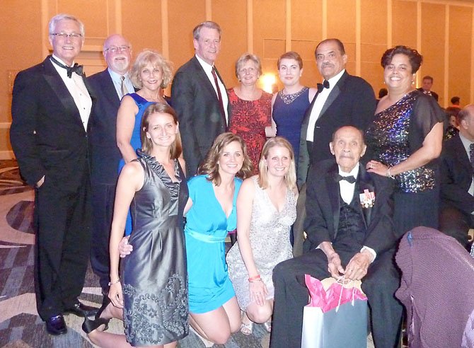 The Donley, Greene and Swanson families gather for a photo with Janet Barnett and Greg Murphy after being honored at the Generation to Generation Gala March 23 at the Mark Center Hilton.