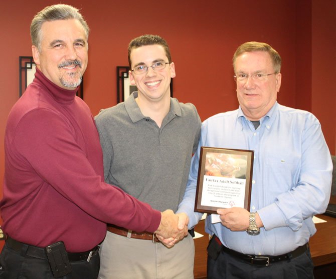 Northern Virginia Special Olympics Chairman Bill Ogletree and son, Special Olympics Global Messenger Kevin Olgetree, present a thank you plaque to FAS President John Carney.
