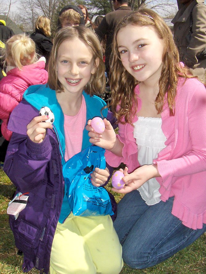 Carolyn Rohr, left, and Kaitlyn Ellis, both 10, show the eggs they found. 