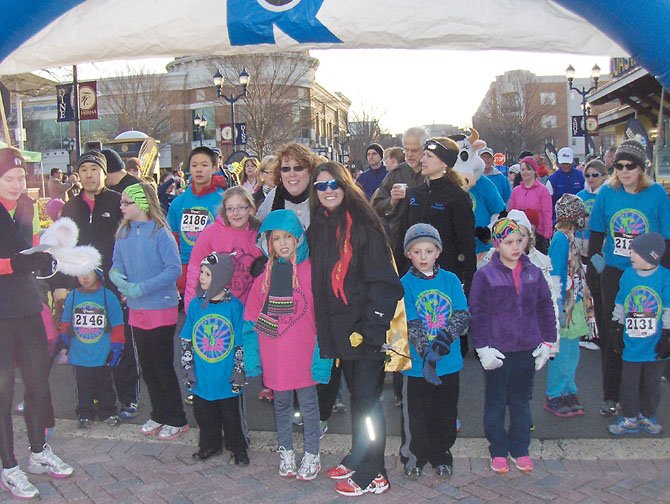 From left are Tara Sankner and BethAnn Telford before the start of the 1K event at Fairfax Corner. Tara’s mom, Tammy Sankner, is behind them.
