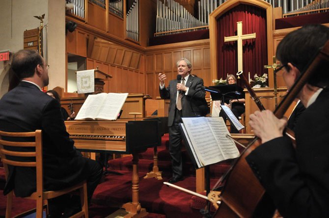 Dr. J. Reilly Lewis leads a full orchestra of violins, violas, oboes, trumpets, a bass, bassoon, tympani, harpsichord and organ in the second and third parts of George Frideric Handel’s Messiah.
