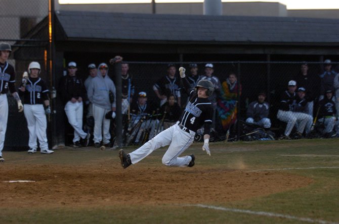 Centreville’s Drew Brickwedde slides into home plate against West Potomac on Tuesday.