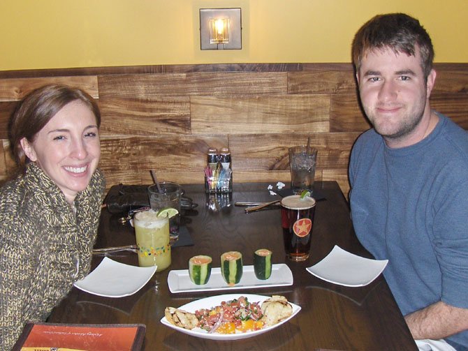 Jenelle Whittaker (left) and Ryan Owens enjoy Southwestern Caprese Tapas and Gazpacho Shots.