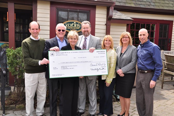 From left, Old Brogue owner Mike Kearney, local realtor Bob Nelson, Operation Second Chance Founder Cindy McGrew, Stephen Dulaney, Tami Harsanyi and Pam Hennessey of State Farm and and Rob Jolles of Jolles Associates at Katie’s Coffee Shop Thursday, April 4. State Farm presented a check for $1,500 to Operation Second Chance, which provides care and assistance to combat veterans. 