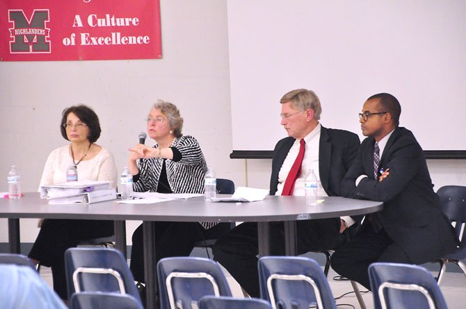 From left, McLean Citizens Association President Sally Horn, Dranesville School Board Reprasentative Janue Strauss, Supervisor John Foust (D-Dranesville) and Marty Smith, Cluster I assistant superintendent, speak to parents at McLean High School Monday, April 8. 