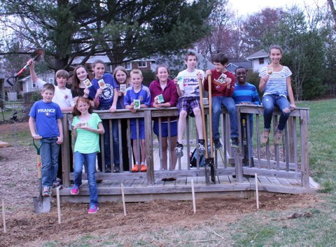 Churchill Road Eco-patrols and Gold Award candidate Aerryn Rees admire the garden they just planted by the school’s outdoor classroom. Clockwise, from left front:  Churchill Road Eco-patrols Cassie Reis, Ben Higbee, Matthew Loftus, Natalie Ryan, Hope Ollivant, Grace Ollivant, Ansel Noe, Girl Scout Aerryn Rees, Briton Boiardi, Jake Yates, Dike Illoh and Lauren Cain.
