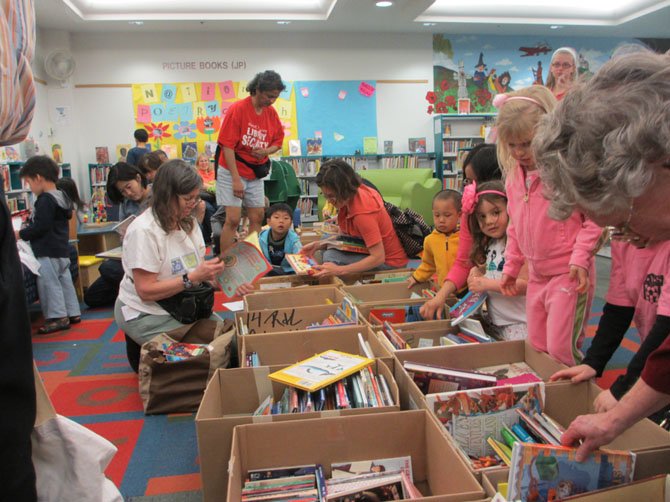 Childrens’ books were placed on floor level for children to sort through. One little girl called the books “amazing.”