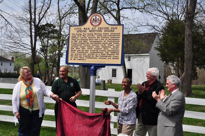 From left, Kala Quintana and Bill Bouie of the Fairfax County Park Authority Board, Supervisor Cathy Hudgins (D-Hunter Mill), Jack Pitzer, president of the Friends of Frying Pan Farm Park and Del. Tom Rust (R-86), unveil a new historical marker at the Frying Pan Meeting House Sunday, April 14. 