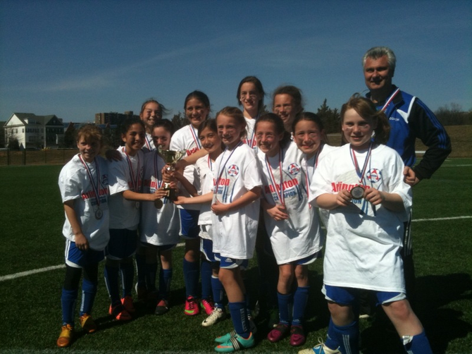 The U10 Girls Pride Blue team, of Great Falls, played and won the Arlington Spring Invitation Tournament March 8-9 and received recognition of their accomplishment at the Sunday, April 21, DC United game. Back row, from left: Emma Cole, Ali Rumpel, Morgan Stup, Ellie Costello, Coach Apostolos Georgiou; front row, from left, Haley Smith, Dani Grieco, Olivia Elkas, Tessa Hunt, Alyssa Costigan, Maya Perelli, Rachael Keenan and Aubrey Augustine.
