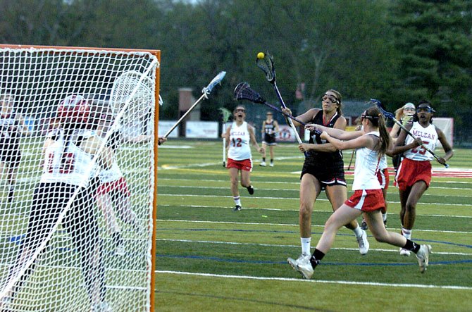 Madison senior midfielder Melissa Kellan shoots during a game against McLean on April 18.