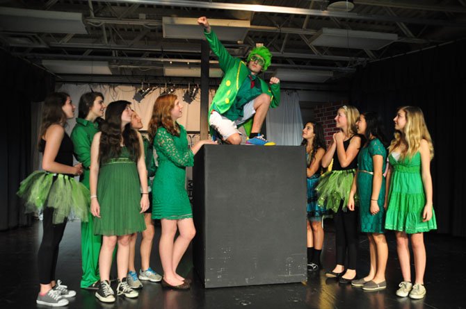 The Ozians surround Aydin Johnson, who plays The Wiz, the title character in Cooper Middle School’s upcoming production. 