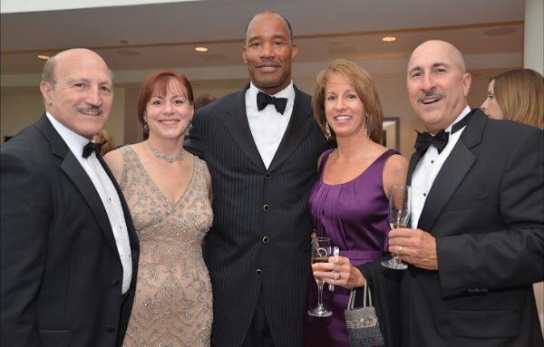 Getting things started at the reception are, from left: Joe Pisciotta, McLean Orchestra President Aileen Pisciotta, former Redskins player and Master of Ceremonies Charles Mann, Lisa Levine and Ralph Petta.
