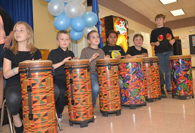 Keeping the beat—the Dranesville Drumming Dragons provide the tempo for the chorus as they perform the South African hymn, “Siyahamba.”
