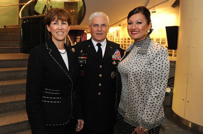 Lani Hay (right), president of Vienna-based Lanmark Technology Inc., made the 2013 Women Presidents’ Organization list of fastest-growing women-owned companies in the U.S. In 2011, Lanmark partnered with ELLE Magazine to raise awareness among military families on suicide prevention. At the event, Hay was joined by guests Roberta Myers, editor-in-chief of ELLE Magazine (left), and Creative Coalition President Tim Daly (center). 
