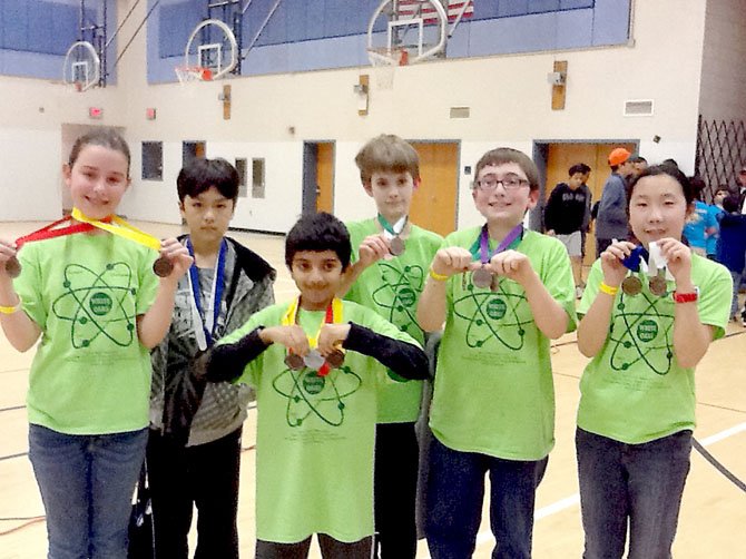 Ella Gilles, John Shim, Mahesh Menon, Cole Quick, Tommy Mehaffey and Kathy Kang after the regional competition awards ceremony in March. 
