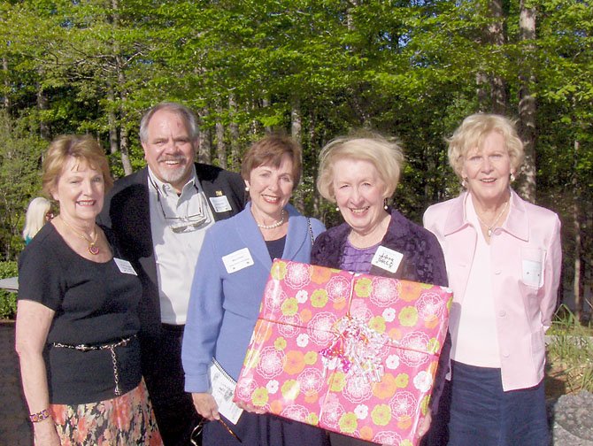 (From left) are CCWC President Kay Gilbert; Tom Reynolds, representing sponsor GMU Center for the Arts; homeowner Mary Presta; and event co-chairs JoAnne Gallo and Diane Smith. Gallo’s presenting a painting of Presta’s garden to her. Presta, the other homeowners and the homes tour sponsors were honored Sunday at a reception at the Fairfax Station home of Sharon and Mark Gottlieb.
