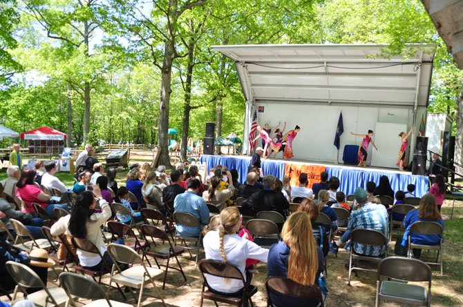 Visitors at Great Falls Day watch a modern dance demonstration behind the Grange Sunday, May 5. 