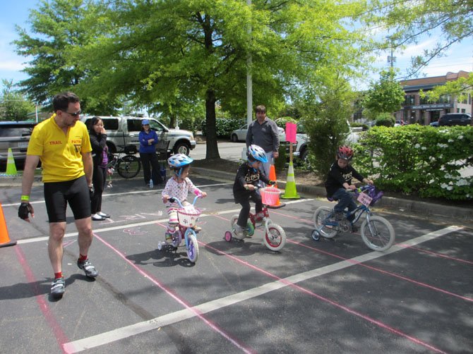 Ladies and gentlemen, start your pedals… a member of the W&OD bike patrol paces youngsters negotiating lanes.
