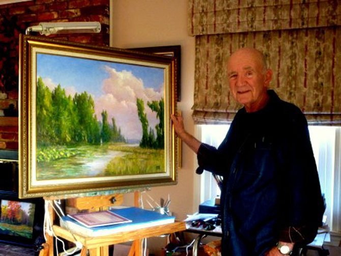 Emergent artist Donald Rogich poses with a landscape work of the scenic George Washington parkway near Alexandria. Price points for work by local artists can range from $100 to $500, and are a heartfelt present for mom. 