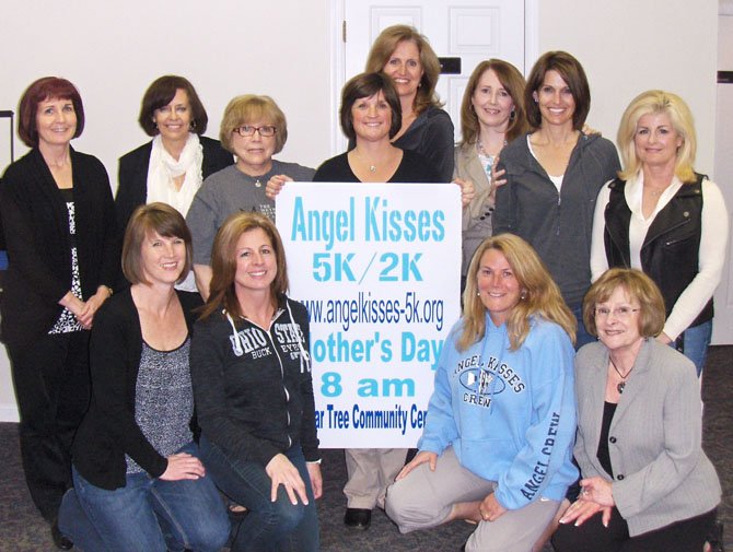 Angel Kisses committee members are (back row, from left) Colleen Thompson, Paula Searle, Joleeta Bishop, Tasha Virostek, Gretchen Mason, Mary Sawyer, Page Imperial and Terry Durst and (front row, from left) Karen Cragg, Teresa Snedeker, Tracy Rickard and Janel Ball.