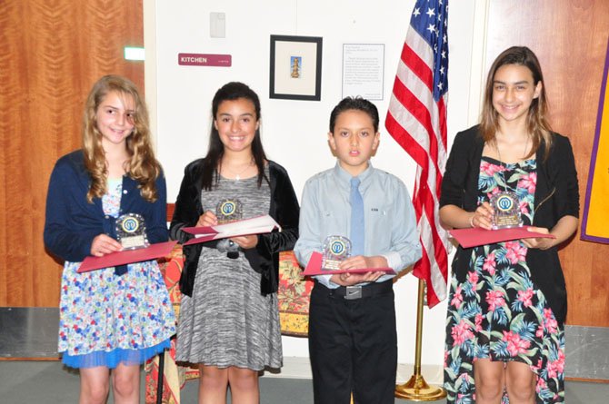 From left, Great Falls sixth graders Katarina Christie, Sabrina  Vazquez, Alejandro Garcia Donoso and Daniela Arbid are honored by the Great Falls Optimist Club Wednesday, May 8.     