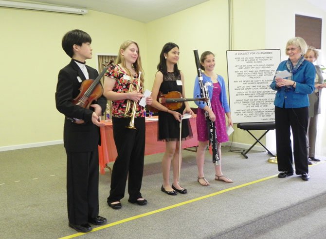 From left: Student musicians Minyoung Hwang, of Longfellow Middle School; Nancy Kurtic, of Cooper Middle School; Katherine Quion, of Cooper Middle School; Jennifer Steele, of Longfellow Middle School; Virginia Sandahl, president of the Woman’s Club of McLean, and Marianne Polito, club president emeritus.
